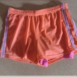Orange and pink spandex shorts